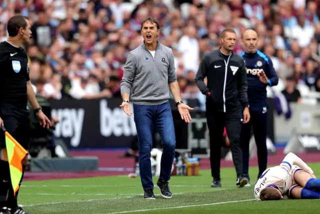 West Ham manager Julen Lopetegui shouts at the assistant referee while Chelsea's Cole Palmer lies injured on the pitch. 