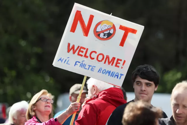 Protestors stand at the peace camp on the road to Shannon Airport during Mr Trump's last visit