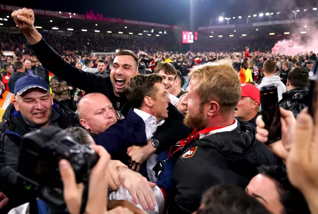 Bournemouth boss Scott Parker (centre) celebrates winning promotion