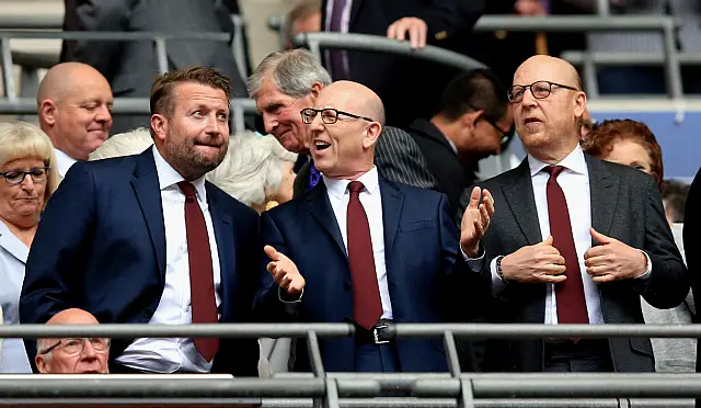 Manchester United chief executive Richard Arnold with co-chairmen Joel Glazer and Avram Glazer