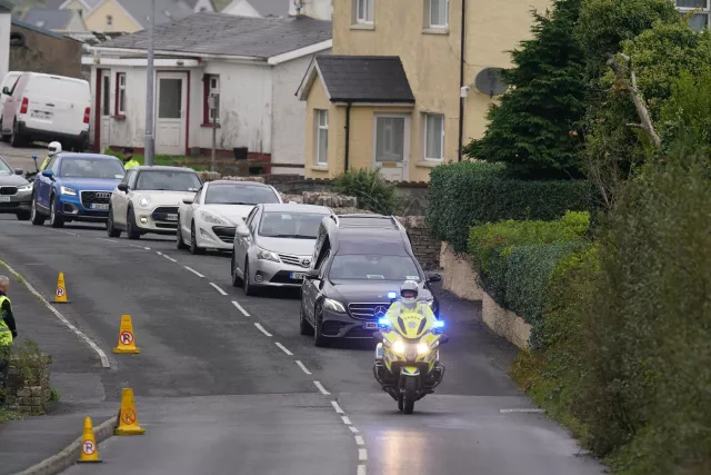 The hearse carrying the coffin of James O’Flaherty makes its way to St Mary’s Church