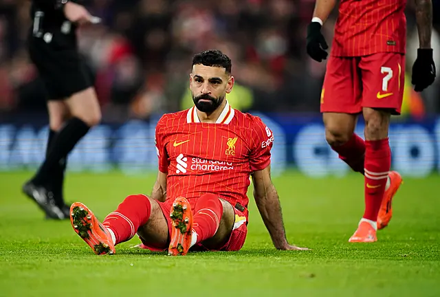 Liverpool’s Mohamed Salah reacts after missing a penalty kick