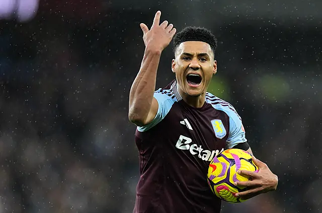 Ollie Watkins raises his arm to gesture to the Villa fans