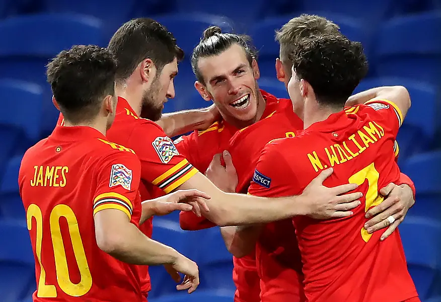 Wales' David Books celebrates his winner against Ireland with Gareth Bale (centre) and their team-mates