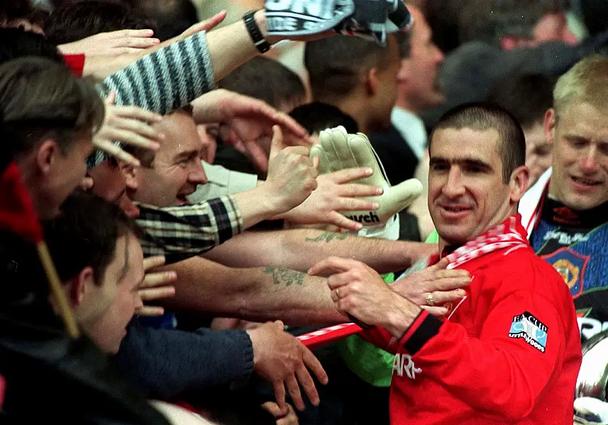 Eric Cantona is greeted by fans after Manchester United's 1996 FA Cup win