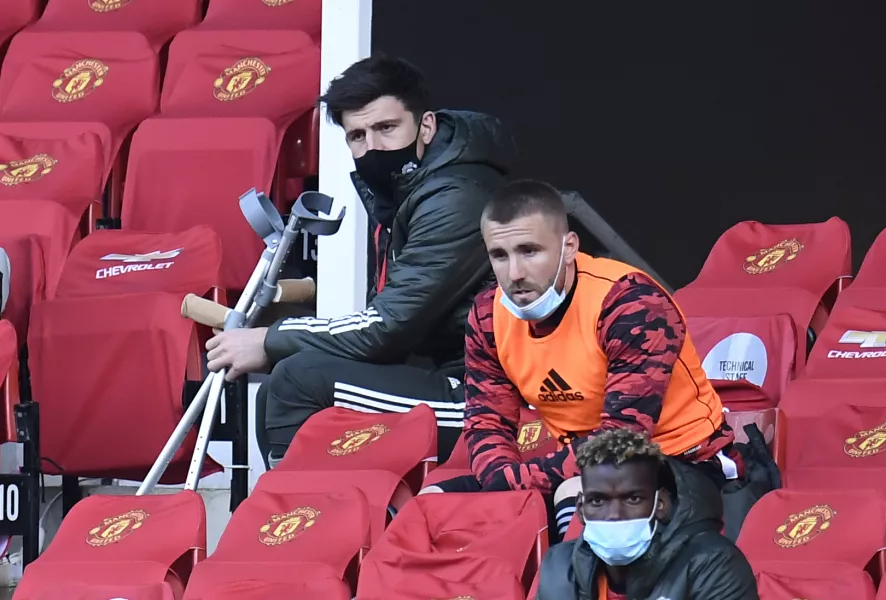 Maguier (top) watched the midweek Premier League defeat to Liverpool while using crutches.