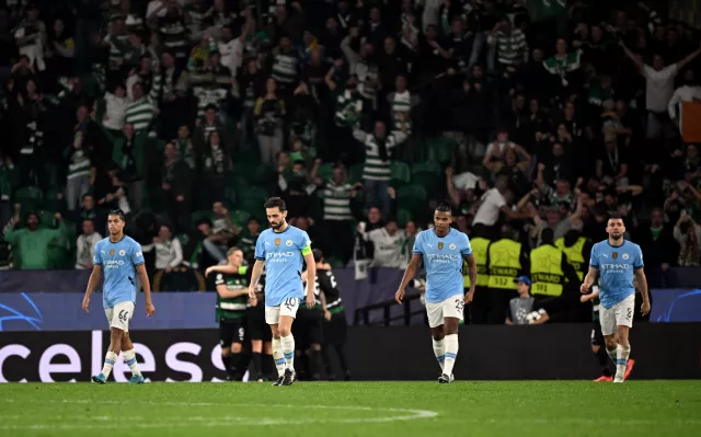 Manchester City players look dejected after conceding to Sporting Lisbon