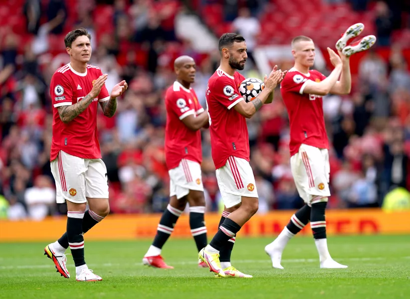 Manchester United’s Bruno Fernandes holds the match ball