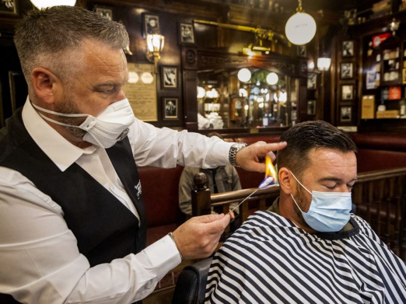 A cut above the rest: Eight gardaí get hair cut at Pearse Street Garda station