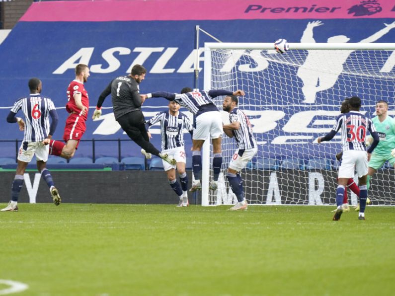 Goalkeeper Alisson heads in dramatic winner as Liverpool stay in top-four hunt