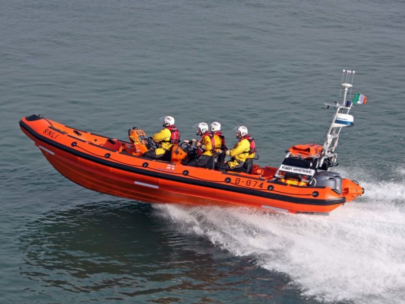 Helvick Head RNLI assist two children adrift on inflatable off Clonea Beach