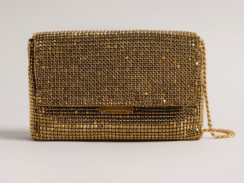 Found: Brown purse covered in golden shapes in Gracedieu