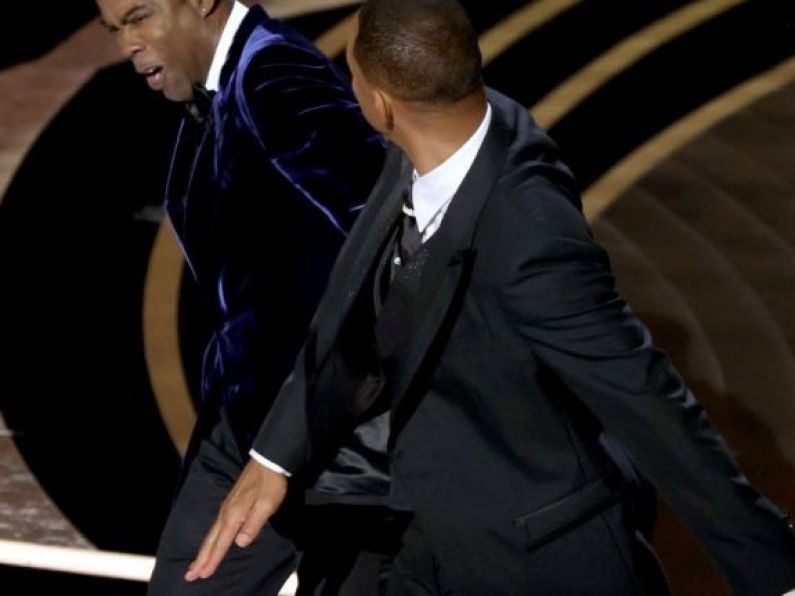 Drama at the Oscars as Will Smith slaps host Chris Rock in defence of wife