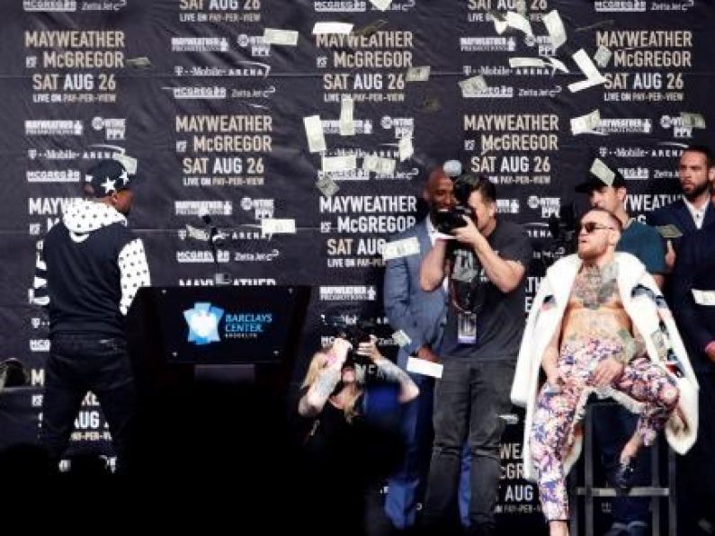 Floyd Mayweather throws dollar bills at Conor McGregor as press tour continues