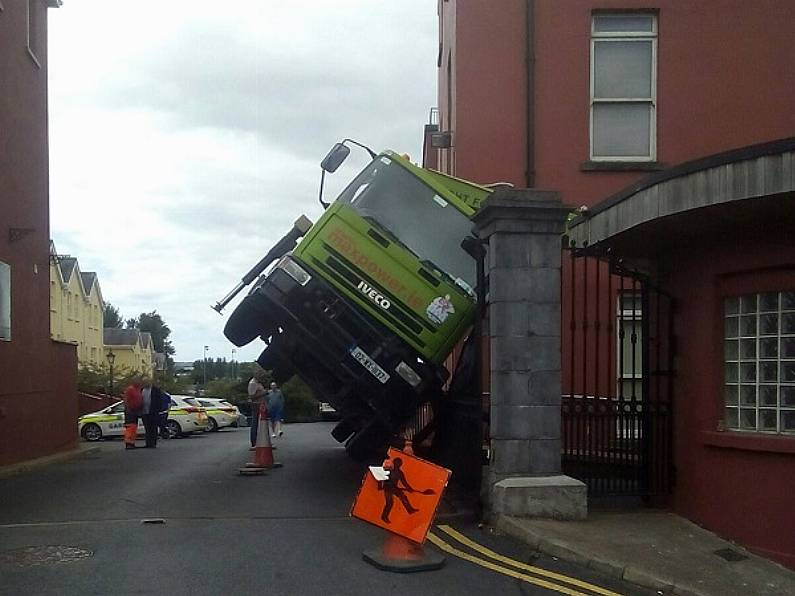 Man injured after truck overturns in Waterford