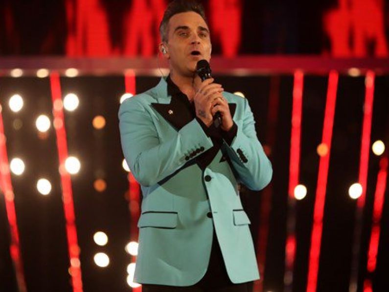 Robbie Williams booked to open World Cup despite offending Russia with song.